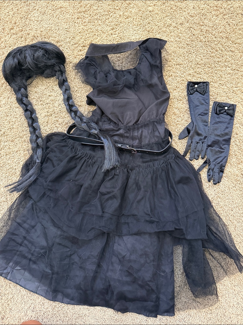 Wednesday costume. Comes with matching wig, belt, gloves.